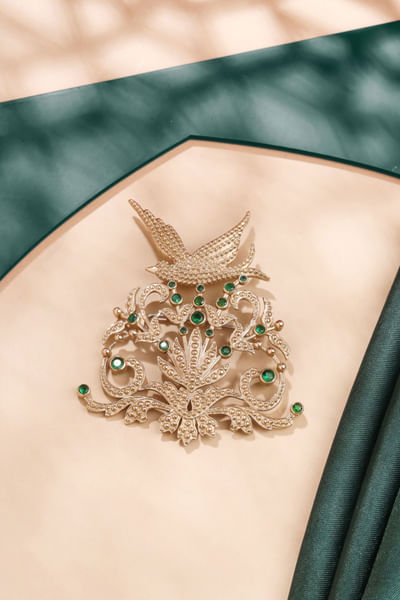 Gold and green bird glass stone brooch