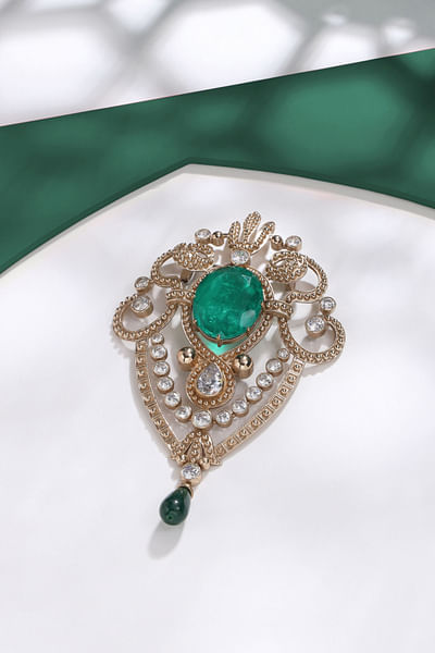 Gold and green gemstone brooch