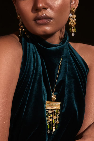Gold and green stone and carved earrings