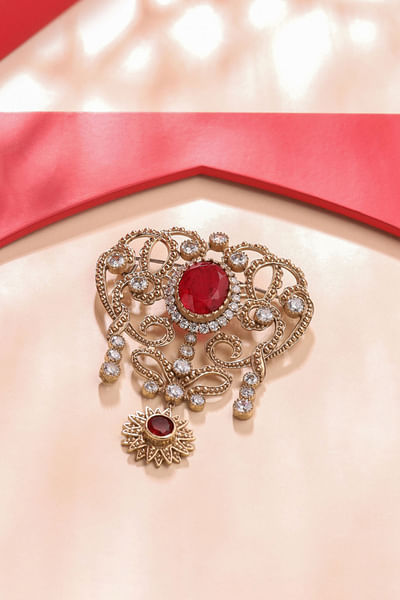 Gold and red floral gemstone brooch