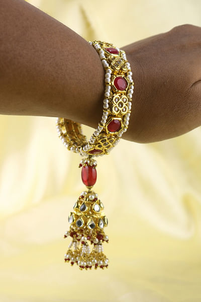 Gold and red stone and jhumka bangle