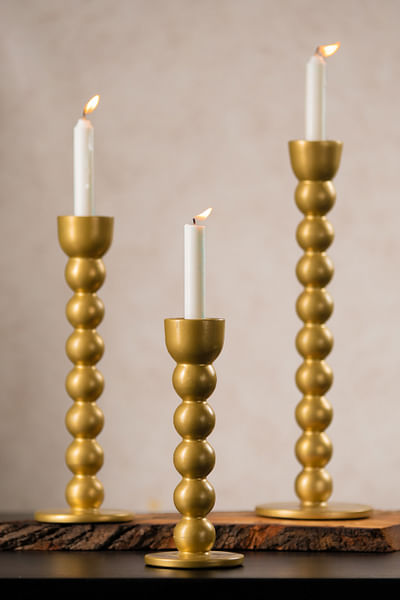 Gold curvy candle holder set