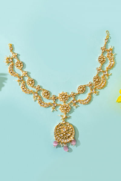 Gold kundan embellished matha patti