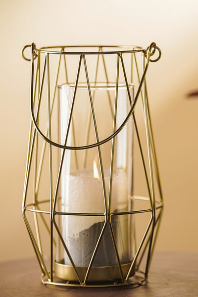 Gold metal and glass mesh lantern