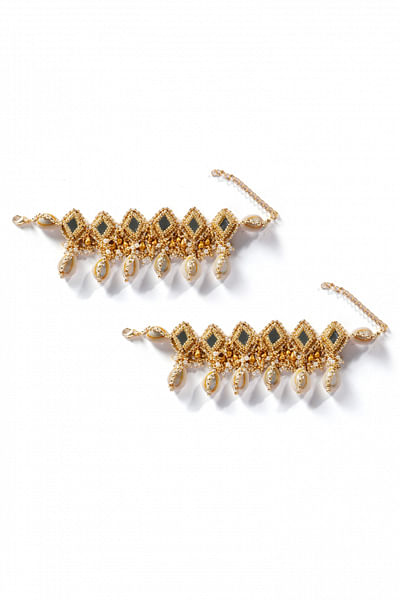 Gold mirror shell armlets