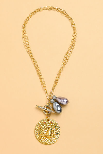 Gold pearl Capricorn zodiac necklace
