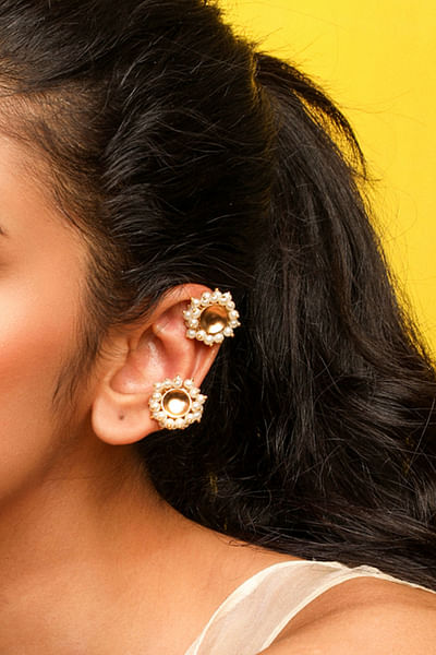 Gold pearl embellished ear buttons