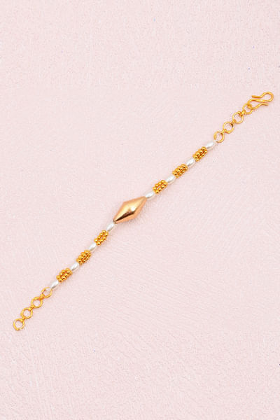 Gold plated pearl detail rakhi