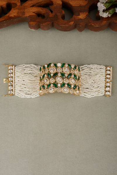 Green and white pearl and stone embellished bracelet
