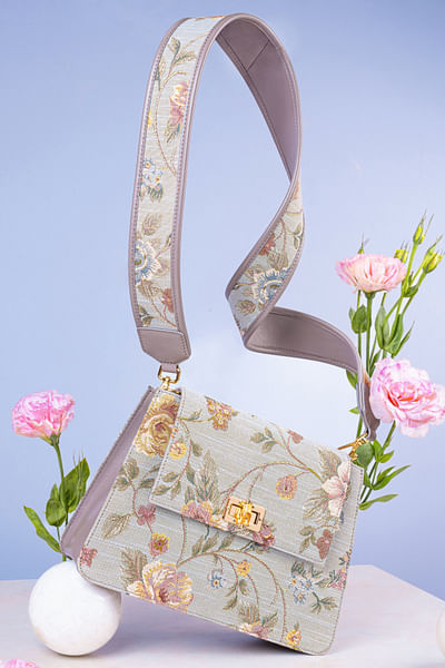 Grey and pink floral woven cross body bag
