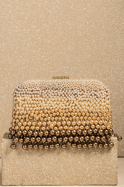 Ivory and gold pearl embellished fringed clutch