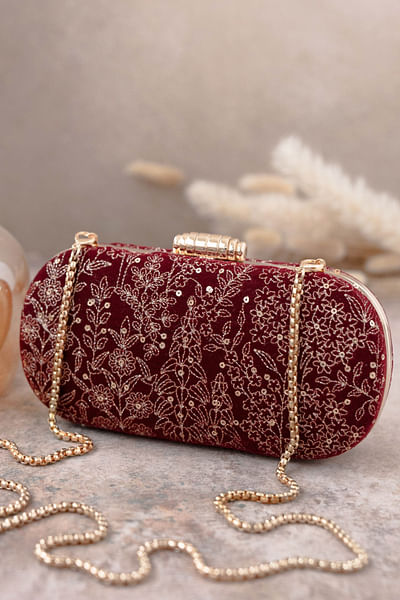 Maroon floral embroidery capsule clutch