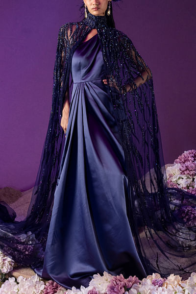 Midnight blue embellished cape and one-shoulder draped gown