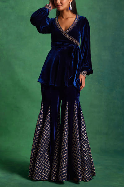 Navy blue embroidered peplum top and godet pants