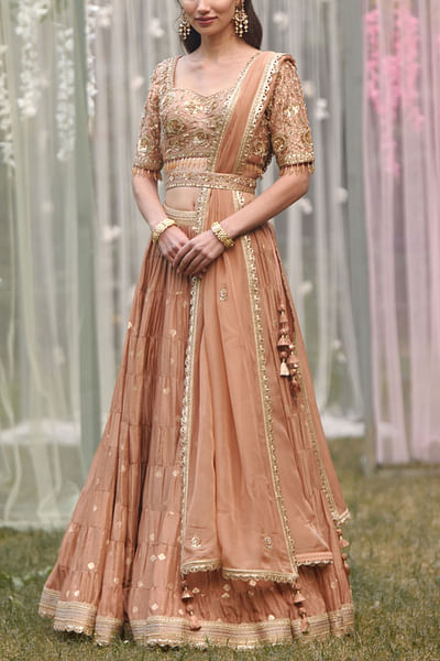 Neutral pink tiered brocade lehenga set