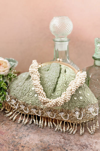 Pastel green thread and mirror embroidery purse