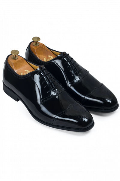 Patent black leather brogues