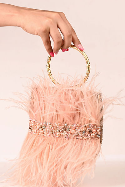 Peach crystal and pearl embellished clutch