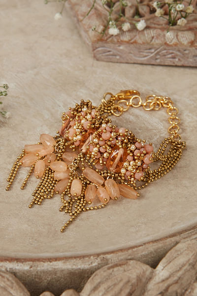 Peach pearl embellished drop bracelet