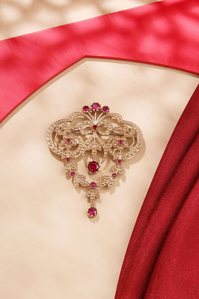 pink glass stonework brooch