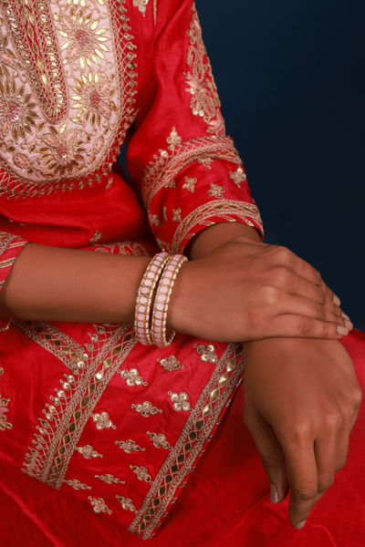 Pink kundan and pearl embellished bangles