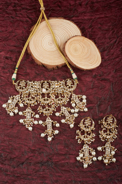 Red and white kundan and pearl choker set