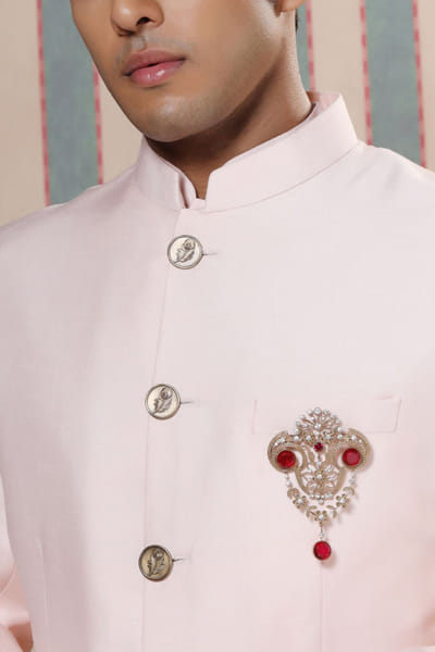 Red glass stone studded royal brooch