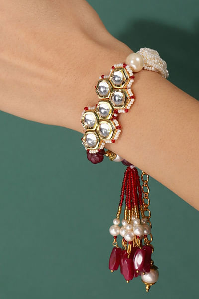 Red kundan and stone tassel bracelet