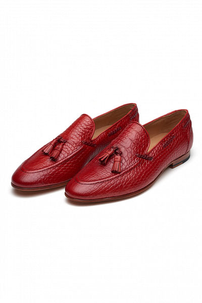 Red tasselled textured leather loafers