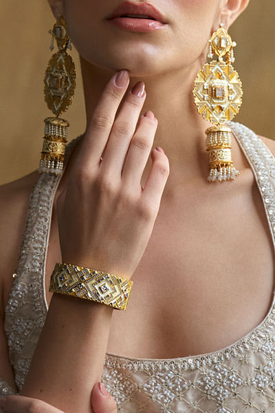 White and gold enamel and cubic zirconia bangle