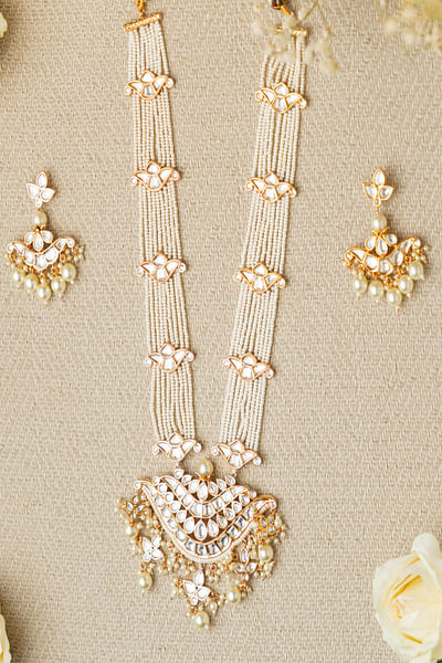White pearl and kundan long pendant necklace set