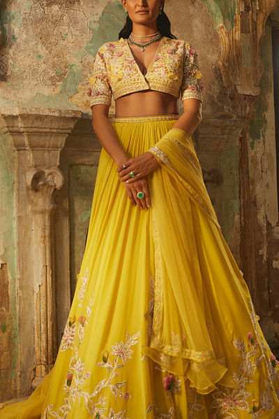 Yellow embroidered net lehenga set