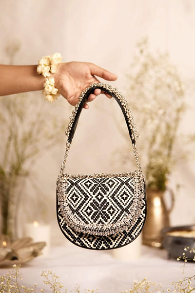 Black geometric woven and beaded handbag