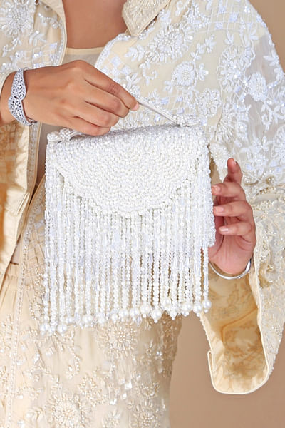 Cream pearl and crystal tasselled clutch bag