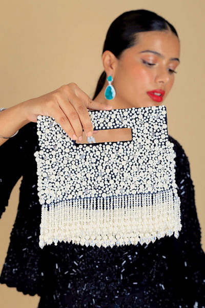 Black pearl tasselled clutch bag