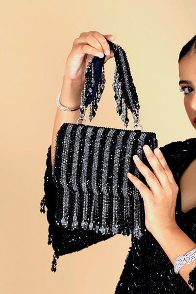Black crystal tasselled clutch bag