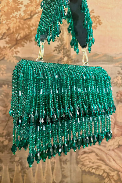 Green crystal tasselled curved clutch bag