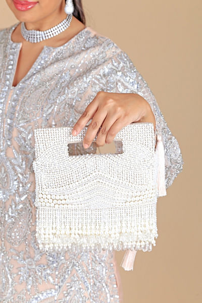 Cream crystal and pearl tasselled clutch bag