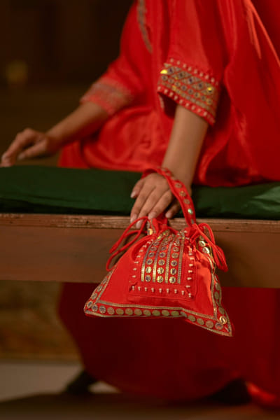 Red embroidered potli bag