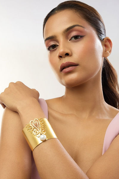 Gold heart and pearl statement cuff