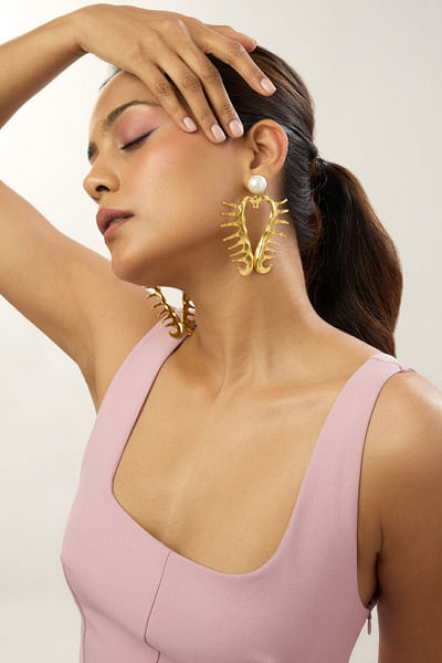 Gold heart and pearl statement earrings