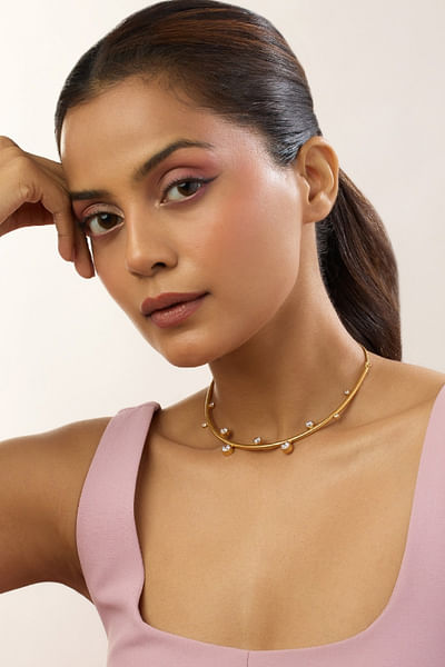 Gold diamond wave statement necklace