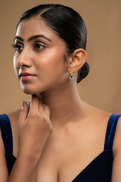 Green stone-studded earrings
