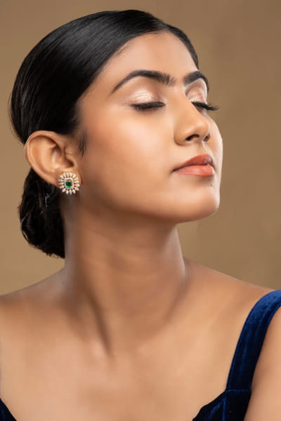 Green stone-encrusted earrings