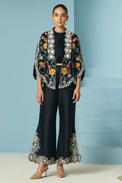 Black floral cutwork bell-bottom pants