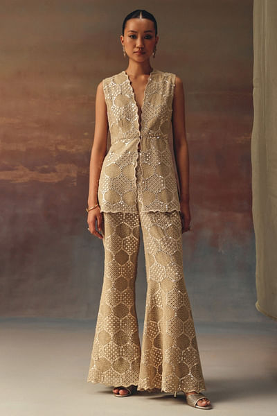 Gold embellished and scalloped peplum top