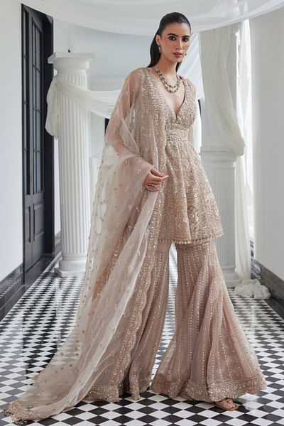 Beige embroidered tissue peplum sharara set