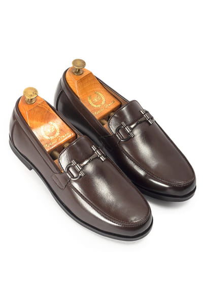 Brown buckled faux leather penny slip-ons