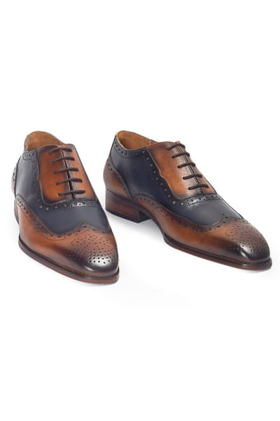Tan and navy lace-up patina leather shoes