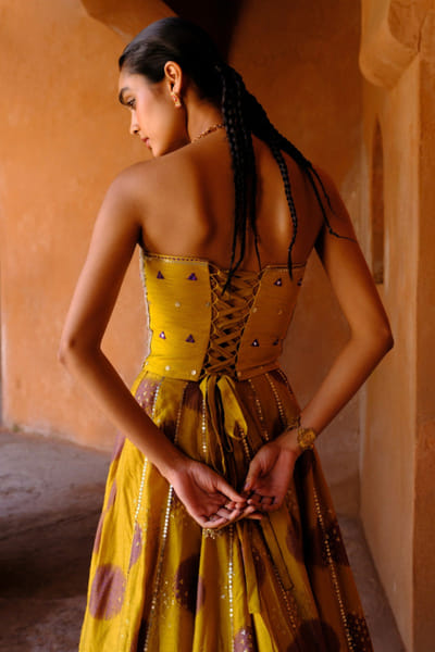 Drishti & Zahabia Yellow print embroidered corset lehenga set DRISMAY26D144732